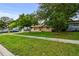 Landscaped front yard and charming single-story house at 1116 Jadewood Ave, Clearwater, FL 33759