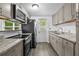 Well lit kitchen featuring stainless steel appliances and granite countertops at 1116 Jadewood Ave, Clearwater, FL 33759