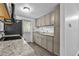 Kitchen featuring modern appliances, granite countertops, and new cabinets at 1116 Jadewood Ave, Clearwater, FL 33759