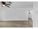 A simple living room with ceiling fan and plank flooring at 1116 Jadewood Ave, Clearwater, FL 33759