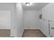 Utility room with wood-look floors, white walls, and basic hookups at 1116 Jadewood Ave, Clearwater, FL 33759