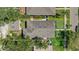 Aerial view of the home's roof and yard, showing mature trees and landscaping at 1119 Highland S St, St Petersburg, FL 33701