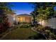 Scenic backyard at twilight with landscaped garden beds and a peaceful ambiance at 1119 Highland S St, St Petersburg, FL 33701