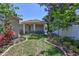 Beautiful backyard featuring lush greenery, brick-lined garden beds, and a serene atmosphere at 1119 Highland S St, St Petersburg, FL 33701