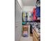 Organized walk-in closet with hanging clothes, storage shelves, and extra space at 1119 Highland S St, St Petersburg, FL 33701