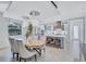 Open concept dining room with a view of a modern kitchen and elegant dining furniture at 1119 Highland S St, St Petersburg, FL 33701