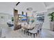 Bright dining room featuring an eye-catching chandelier and a sleek wall-mounted TV at 1119 Highland S St, St Petersburg, FL 33701