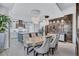 Elegant dining room with modern lighting and a wine bar adjacent to the kitchen at 1119 Highland S St, St Petersburg, FL 33701