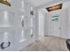 Elegant entryway featuring recessed display niches and a modern light fixture at 1119 Highland S St, St Petersburg, FL 33701