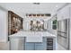 Contemporary kitchen with a large island, stainless steel appliances, and a view to the dining room at 1119 Highland S St, St Petersburg, FL 33701