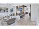 Inviting living room features a custom entertainment center and elegant decor open to kitchen at 1119 Highland S St, St Petersburg, FL 33701