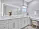 Beautiful main bathroom with a large, illuminated mirror and walk-in shower at 1119 Highland S St, St Petersburg, FL 33701
