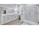 Main bathroom featuring dual sinks and a glass enclosed walk-in shower at 1119 Highland S St, St Petersburg, FL 33701