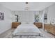 Relaxing main bedroom with large upholstered headboard and a contemporary light fixture at 1119 Highland S St, St Petersburg, FL 33701