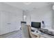 Bright office space featuring a large desk with dual monitors and wood flooring at 1119 Highland S St, St Petersburg, FL 33701
