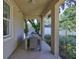 Comfortable covered patio featuring an outdoor dining set, offering a relaxing space to unwind at 1119 Highland S St, St Petersburg, FL 33701