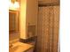 Bathroom features a single sink vanity and a shower with decorative shower curtain at 1212 Rosewood St, Largo, FL 33770