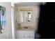 Bathroom features a single sink vanity and a mirror with lighting above the sink at 1212 Rosewood St, Largo, FL 33770