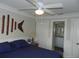 Cozy bedroom with ceiling fan, closet space, and an attached bathroom at 1212 Rosewood St, Largo, FL 33770