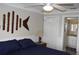 Bedroom featuring a queen-size bed and a doorway leading to the bathroom at 1212 Rosewood St, Largo, FL 33770