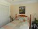 Charming bedroom features a wood bed frame, cozy quilt, and decorative accents at 1212 Rosewood St, Largo, FL 33770