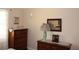 Traditional bedroom showing wooden dressers with decorative details and neutral wall color at 1212 Rosewood St, Largo, FL 33770