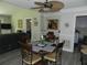 Eat-in kitchen features a dining table with seating and an attached Gathering room at 1212 Rosewood St, Largo, FL 33770