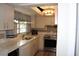 A bright kitchen is equipped with stainless steel appliances, and a stylish backsplash at 1212 Rosewood St, Largo, FL 33770