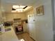 Bright kitchen features recessed lighting, tiled backsplash, and updated appliances at 1212 Rosewood St, Largo, FL 33770