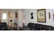 The neutral-toned living room is well-lit, showcasing a sofa and decor at 1212 Rosewood St, Largo, FL 33770