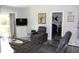 Cozy living room features wood floors, recessed lighting, and sliding glass door at 1212 Rosewood St, Largo, FL 33770