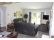 Comfortable living area with sliding glass door, ample seating, and modern decor at 1212 Rosewood St, Largo, FL 33770