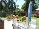Relaxing patio area with dining set and lush greenery providing a private outdoor space at 1212 Rosewood St, Largo, FL 33770