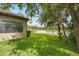 Scenic backyard view featuring a well-manicured lawn and serene water view beyond the fence at 13821 Moonstone Canyon Dr, Riverview, FL 33579