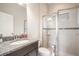 Bathroom featuring granite counters, ample lighting, and glass-walled shower at 13821 Moonstone Canyon Dr, Riverview, FL 33579