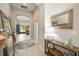 Welcoming entryway with tile flooring, decorative mirrors, and a view into the living area at 13821 Moonstone Canyon Dr, Riverview, FL 33579