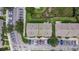 Aerial view of the townhome complex showing parking and landscaping at 13905 Abbey Ln, Largo, FL 33771