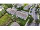Overhead view of townhome community with well-kept landscaping, waterways, and parking at 13905 Abbey Ln, Largo, FL 33771