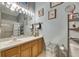 Bright bathroom features a large mirror and wall art at 13905 Abbey Ln, Largo, FL 33771