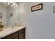 Bathroom features a sleek vanity and decorative accents at 13905 Abbey Ln, Largo, FL 33771