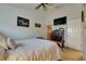 Bedroom with a ceiling fan, flat-screen TV, and closet at 13905 Abbey Ln, Largo, FL 33771
