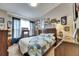 Comfortable bedroom with natural light, a vintage cabinet, and baseball-themed decor at 13905 Abbey Ln, Largo, FL 33771
