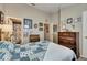 Comfortable bedroom featuring baseball-themed decorations and connected bathroom access at 13905 Abbey Ln, Largo, FL 33771