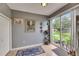 Bright dining area features sliding glass doors to the outdoor patio at 13905 Abbey Ln, Largo, FL 33771