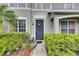 Close-up of the home's front entrance, showing neat landscaping and a charming front door at 13905 Abbey Ln, Largo, FL 33771