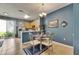 Bright kitchen with tile flooring, light wood cabinets, and an eat-in dining area at 13905 Abbey Ln, Largo, FL 33771