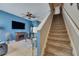 Cozy living room with a fireplace and staircase at 13905 Abbey Ln, Largo, FL 33771