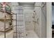 Shower stall featuring a striped shower curtain and shelving at 13905 Abbey Ln, Largo, FL 33771