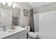 Bathroom with updated vanity, framed mirror, and shower with curtain at 1400 Gandy N Blvd # 809, St Petersburg, FL 33702