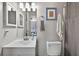Bathroom with updated vanity, framed mirror, and shower at 1400 Gandy N Blvd # 809, St Petersburg, FL 33702